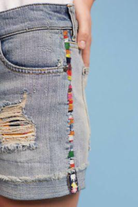 Denim stitched with colour on side seams