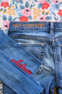Denim jacket with embroidered lettering
