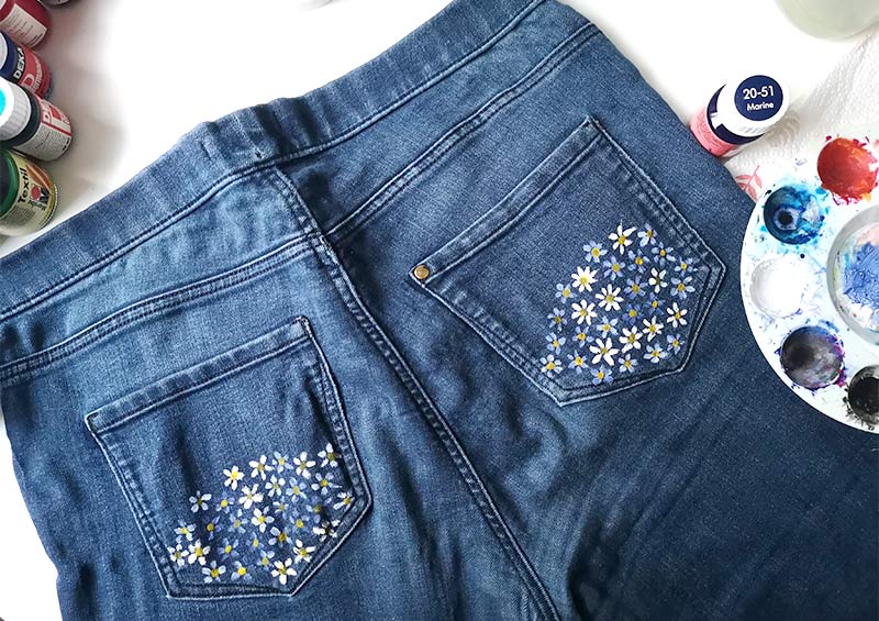 Denim with daisies painted on pockets
